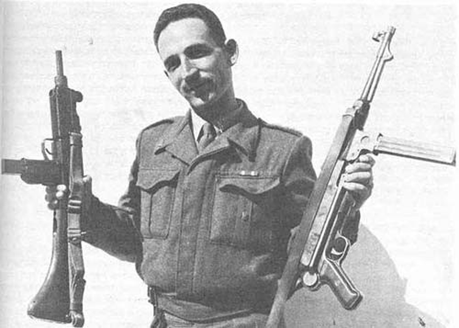 a unique photo of Major Uziel Gal holding an Uzi and a MP38
